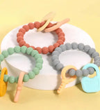 Mordedor de Silicona Tipo Pulsera con Dijes